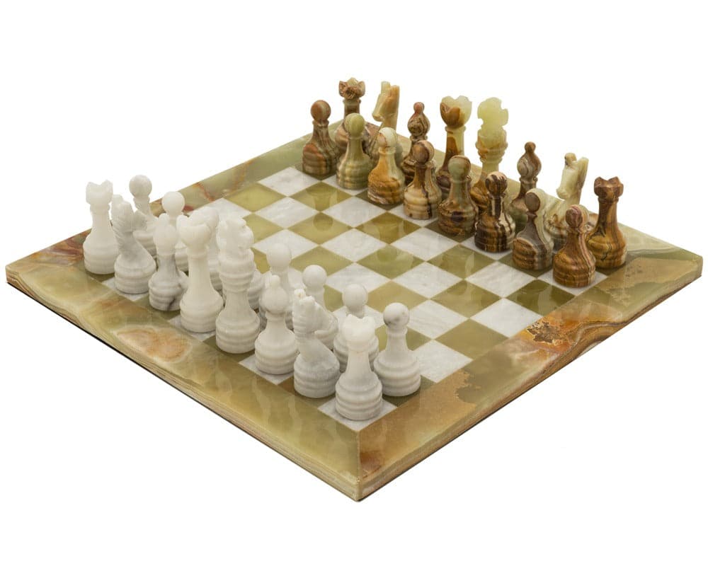 The Alghero Onyx and Marble Chess Set with intricately designed white and brown chess pieces on a checkered marble board.