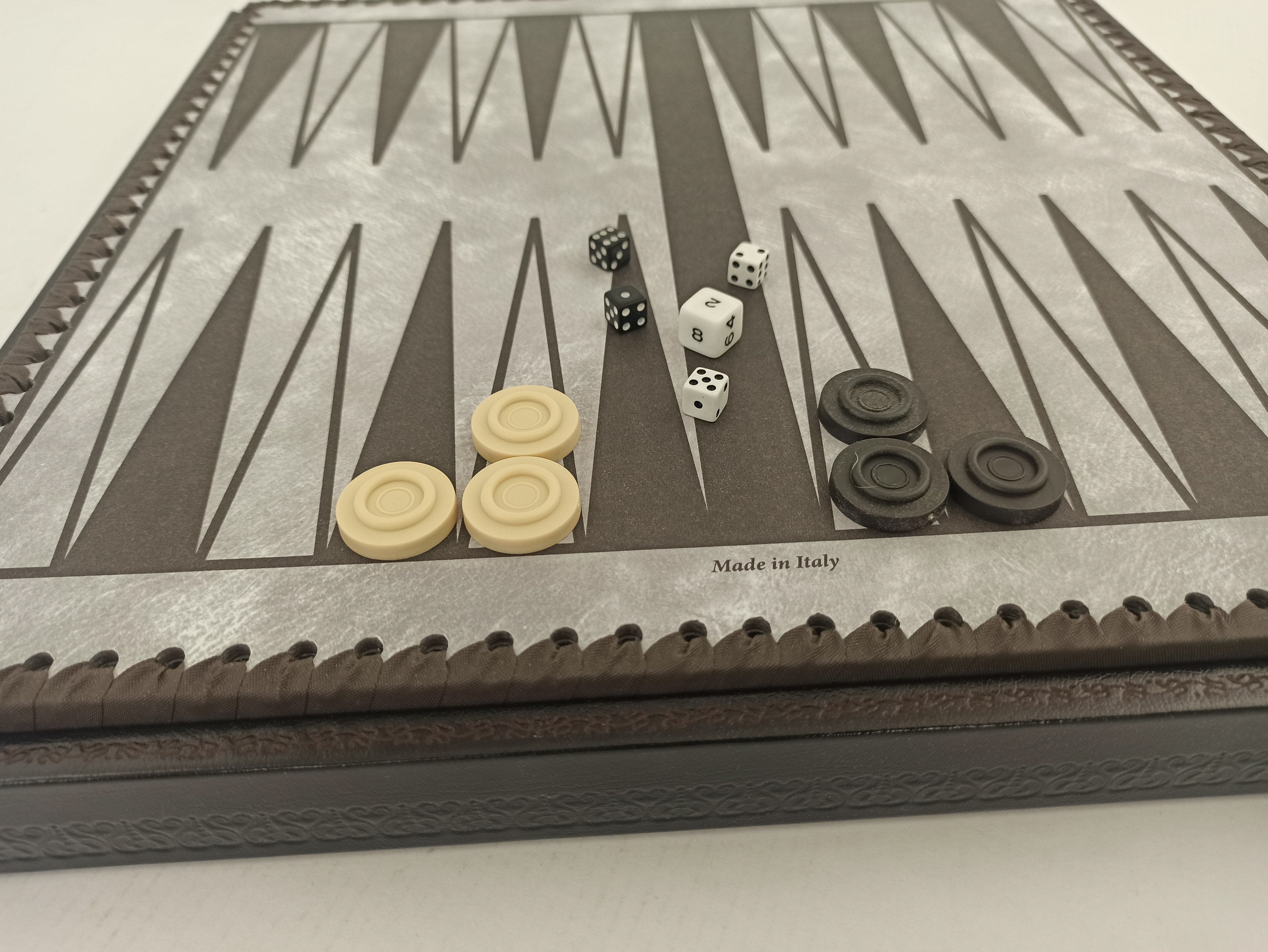 Italian Nero backgammon board in black and gold with dice and draughts, made in Italy.