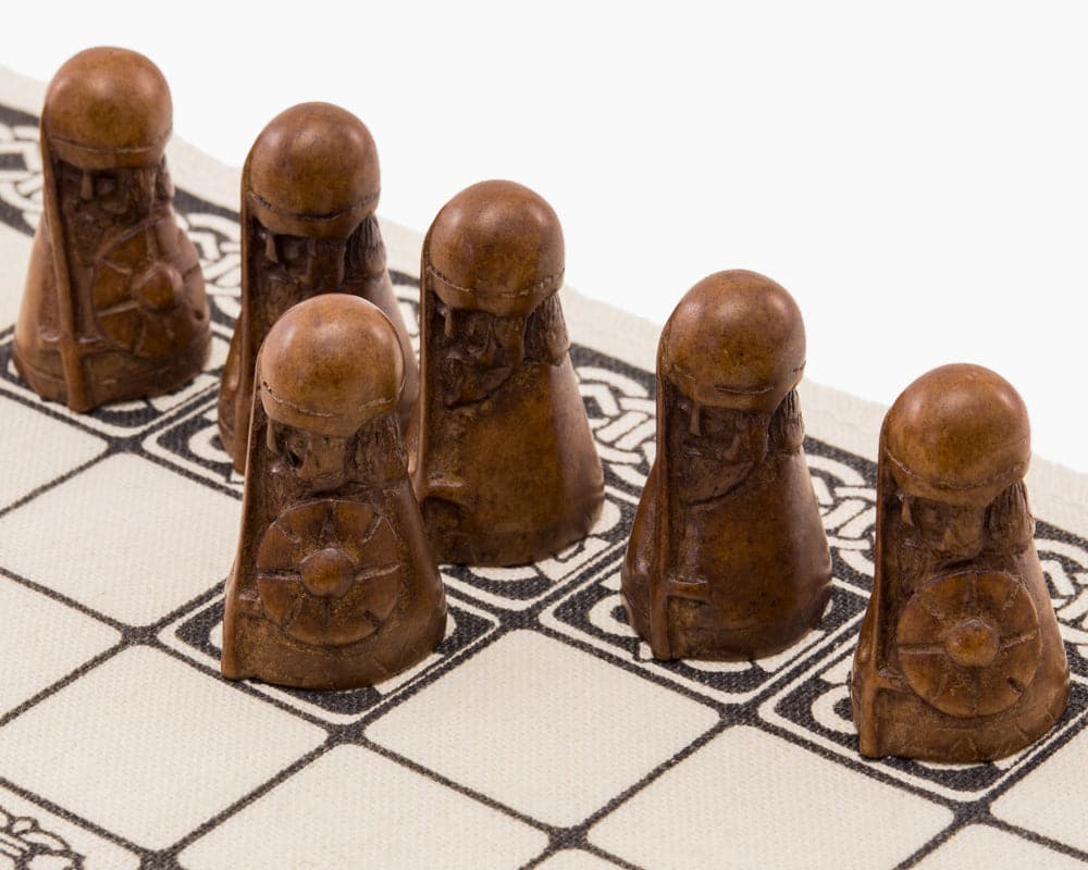 Viking board game Hnefatafl playing pieces on linen surface - National Museum Scotland product