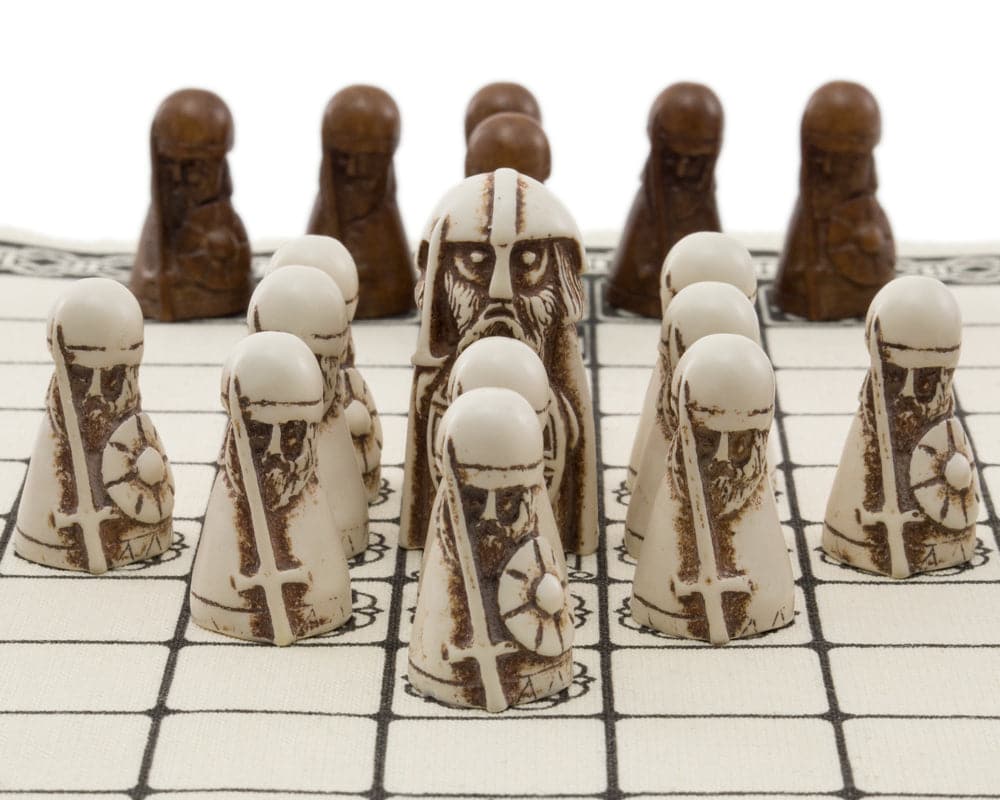 "Viking Board Game Hnefatafl with detailed white King, Defenders, and dark Attackers on linen playing surface"