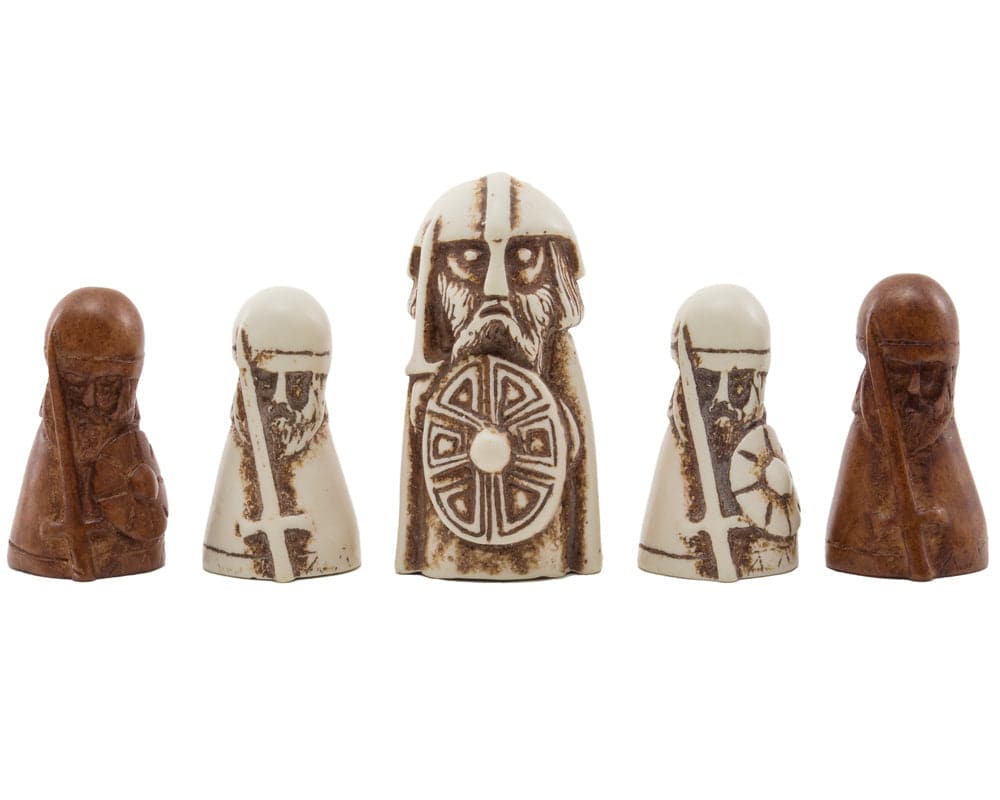 Viking Game (Hnefatafl) white King and Defenders, dark Attackers, carved game pieces in a row on a linen surface, National Museum Scotland product.