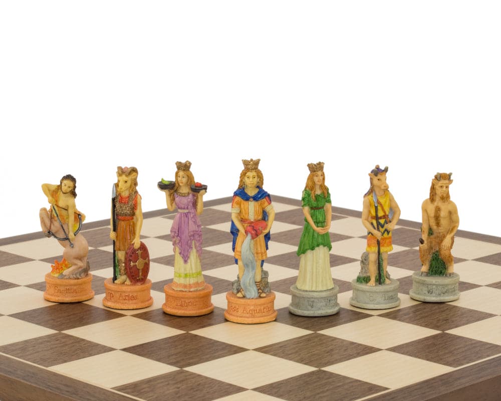 Hand-painted Zodiac-themed Italian chess pieces by Italfama on a chessboard with a 3.25 inch king, ideal for 15.75 inch board