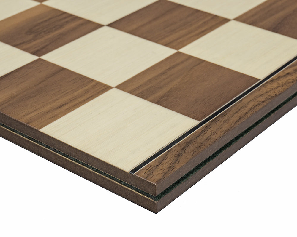 Close-up of 16.75 inch folding walnut and maple chess board crafted in Spain with 1.9 inch squares and an ebonised border for larger chess pieces