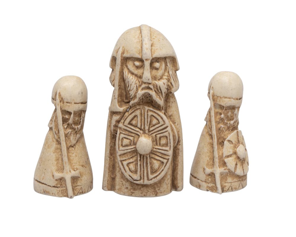 Hnefatafl Viking game pieces featuring a white King and two white Defenders.