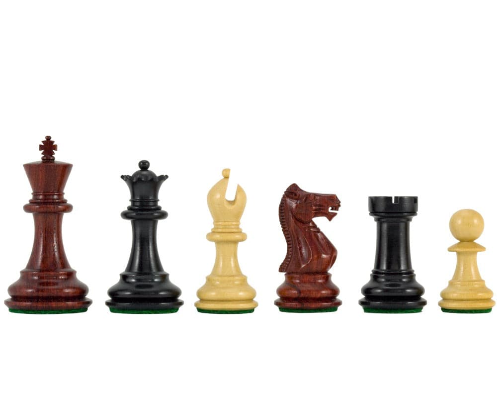 Sandringham Tres Corone luxury chess pieces in ebony, rosewood, and boxwood finish, displaying a 2.5 inch king and other pieces on green bases