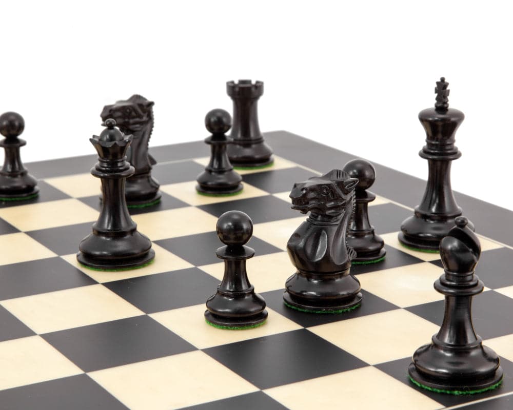 Highgrove Series Ebonised Staunton Chess Pieces on Chess Board