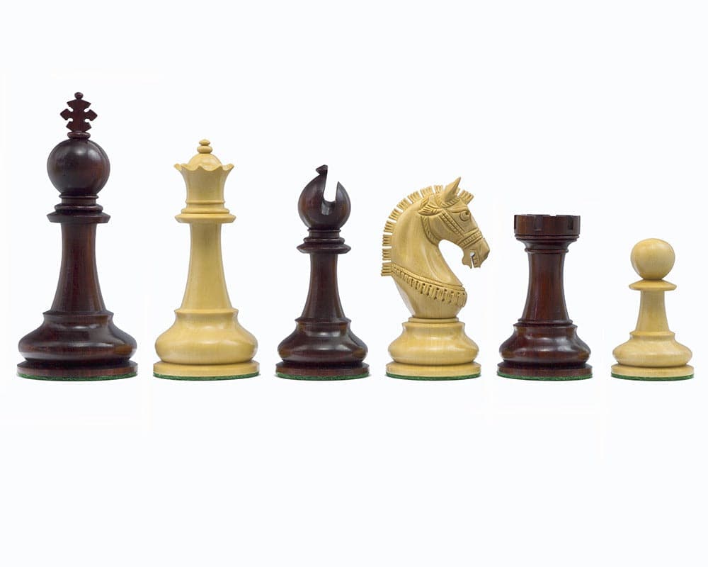 The La Valletta Redwood Chessmen 4.5 inches set featuring detailed knight, all pieces designed with Maltese influence and billiard cloth bases.