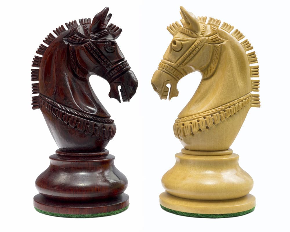 Detail of knights from The La Valletta Redwood Chessmen set, showcasing Maltese-influenced design and intricate craftsmanship.