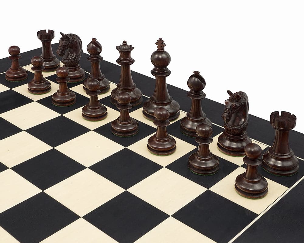 The La Valletta Redwood Chessmen set with detailed knights and weighted pieces on a chessboard, ideal for 21 inch boards.