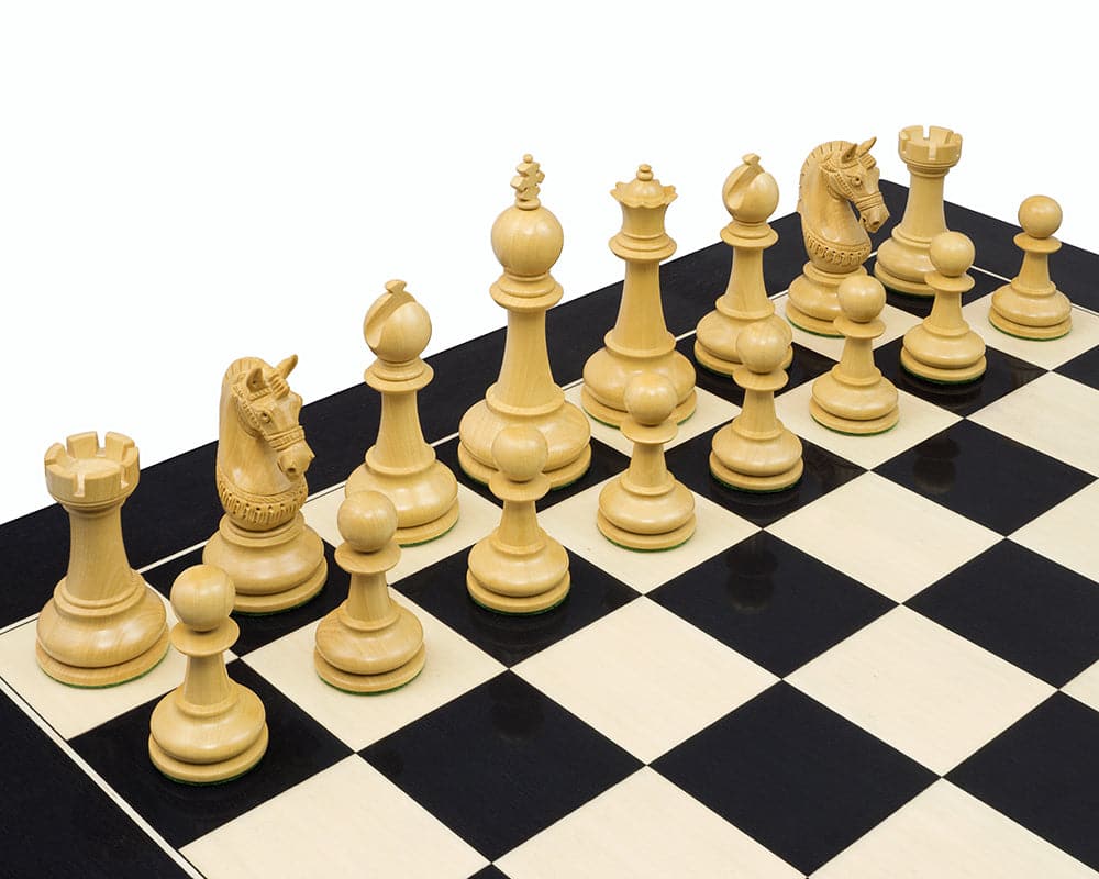 The La Valletta Redwood Chessmen set on a black and white chessboard featuring 4.5 inch king, detailed knights, and weighted pieces with billiard cloth bases