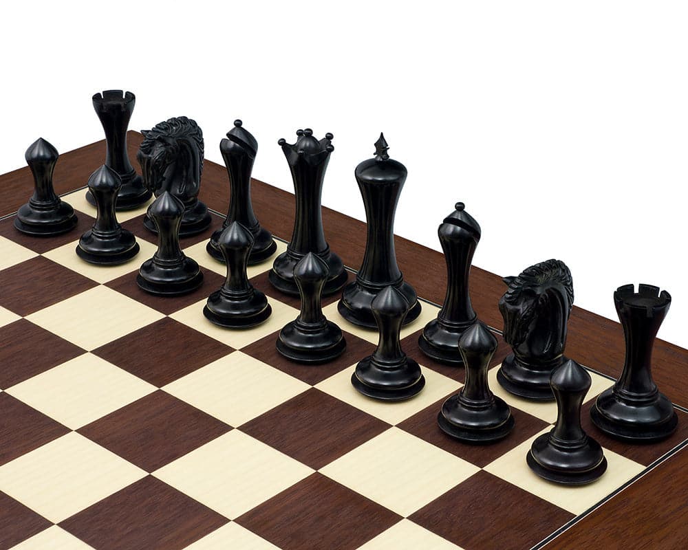 Empire Knight Ebony Chessmen on board, featuring elegant Staunton design with 4.5 inch King and additional Queens for luxury gameplay.