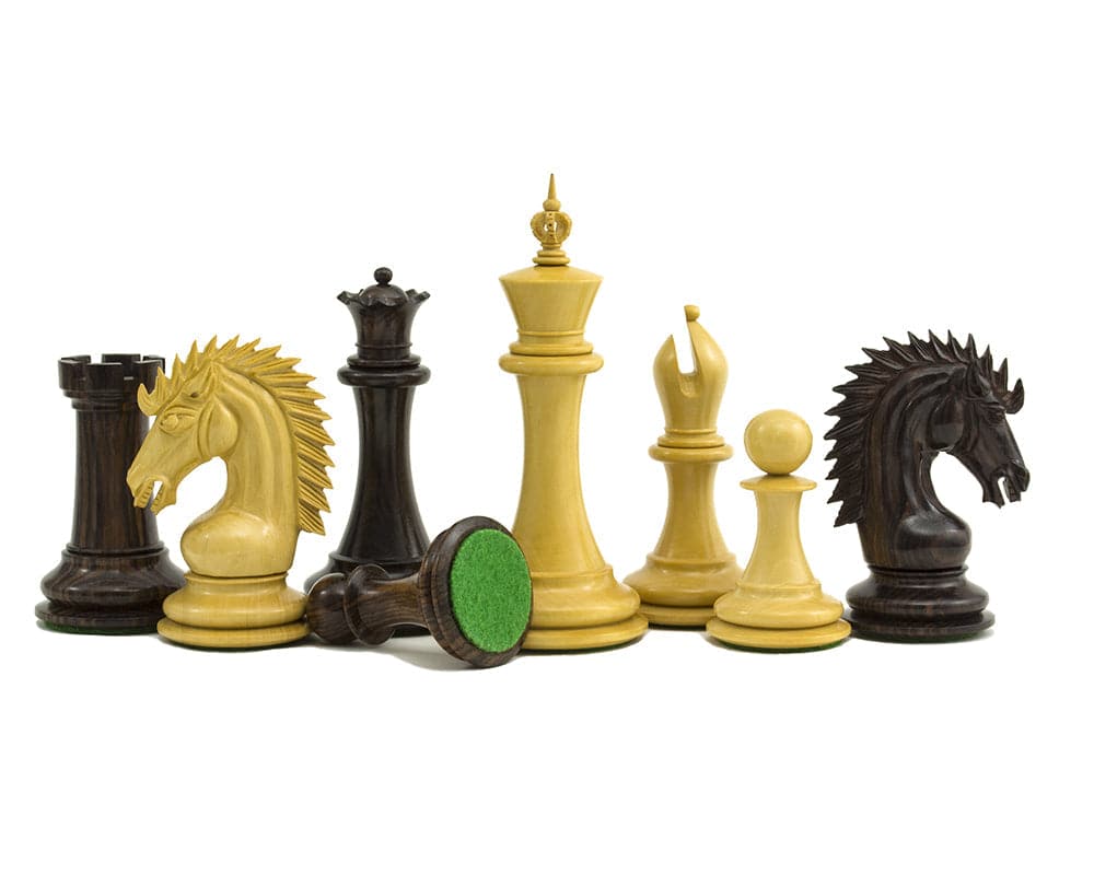 The Sheffield Knight Rosewood Chessmen 4.25 inch set with ornately detailed pieces including Kings, Queens, Bishops, Knights, Rooks, and Pawns.