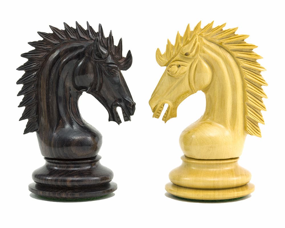 Rosewood and lightwood knight chess pieces with ornate manes and striking facial structures from The Sheffield Knight Rosewood Chessmen set