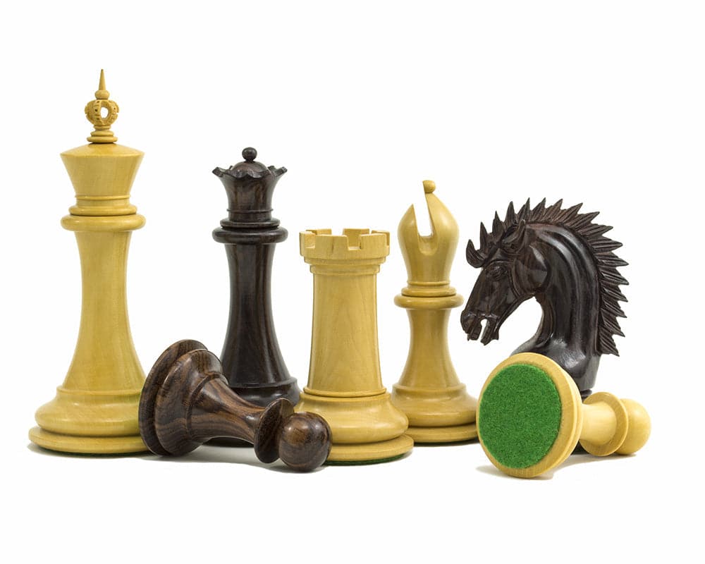 The Sheffield Knight Rosewood Chessmen 4.25 inch, including struck down pieces with billiard cloth bases.