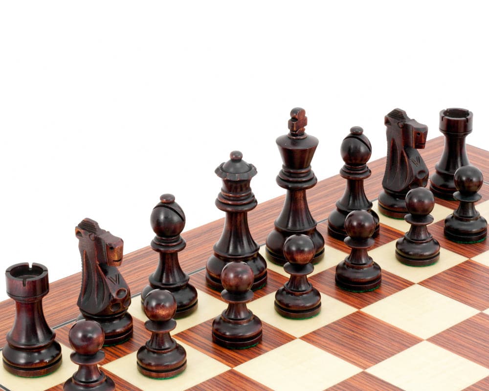 Antiqued British Staunton chessmen in sheesham and boxwood with a 3.75-inch king and unique stain finish on a chessboard.