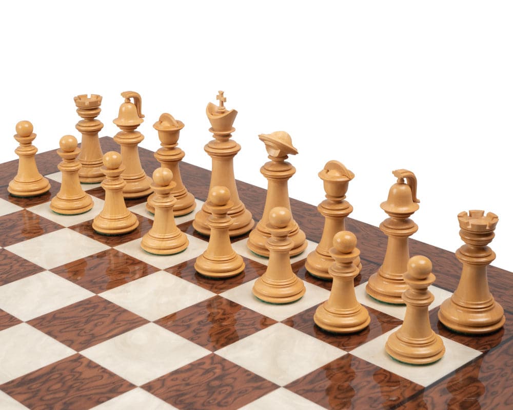 The Greek Staunton Ebony Series chess pieces on a 20-inch board with 2-inch playing squares crafted from high-quality mahogany and birch veneers.