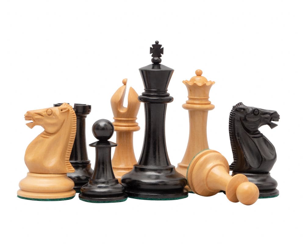 Classic wooden chess pieces including kings, queens, knights, bishops, rooks, and pawns in black and natural wood on a white background