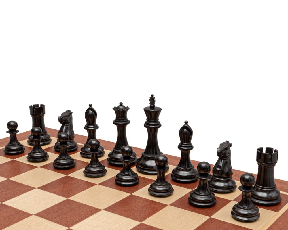 The Abingdon 3.5 inch ebonised chess men on a chessboard displaying traditional Staunton design and superb craftsmanship.