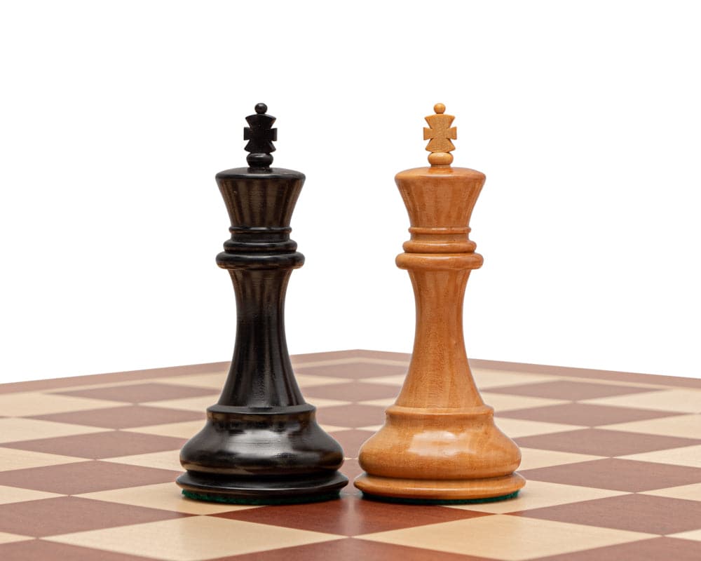 The Abingdon 3.5 inch Ebonised Chess Men featuring black and natural king pieces on a chessboard.