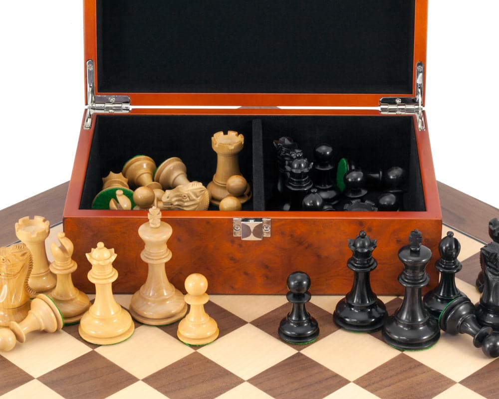 Highgrove Walnut Chess Set with Case displayed on classic walnut and maple board, showcasing ebonised Staunton chessmen and burl effect case.