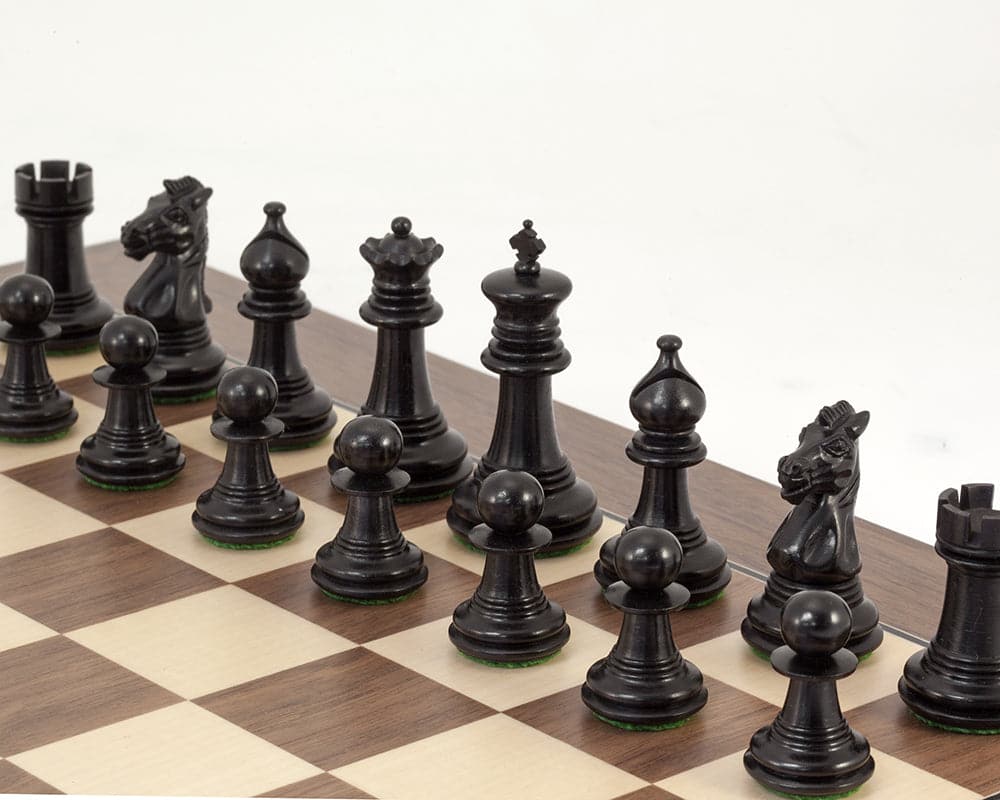 Handcrafted Madrid Tres Corone Ebony chess pieces on walnut and maple board with billiard cloth bases and luxury design.