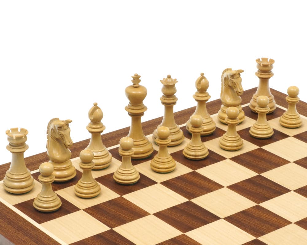 Wooden chess pieces arranged on a rosewood mahogany chessboard