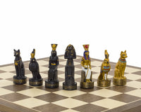 Hand painted Ancient Egypt themed chess pieces by Italfama on a walnut and maple board, including ornate gold and black figurines.