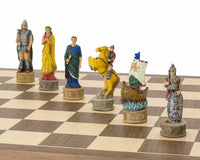 Hand painted chess set showing characters from The Battle of Troy, including a knight on horseback and a ship, on a wooden chessboard
