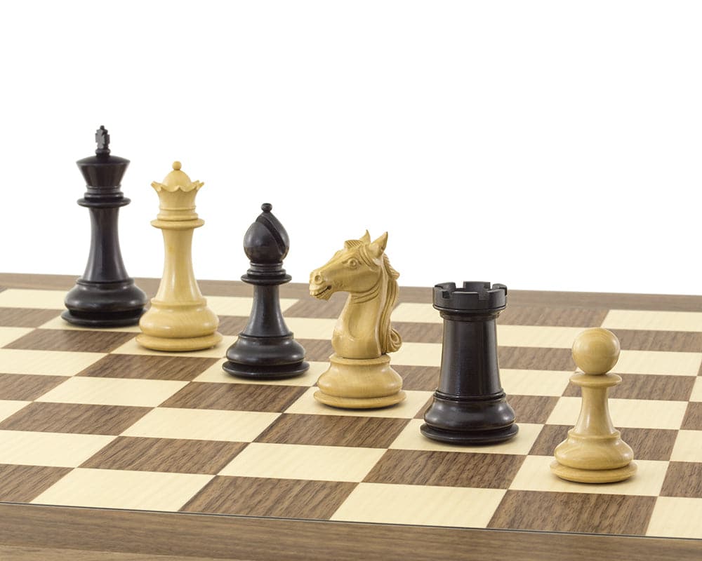 Close-up of the Columbus Ebony and Walnut Chess Set on a 21.7 inch walnut and maple board, featuring ornate Staunton pieces, including a 4 inch King.