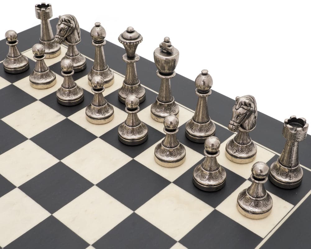 The Finnesburg and Black Classic Ornate Chess Set with detailed silver chess pieces on a black and white board.