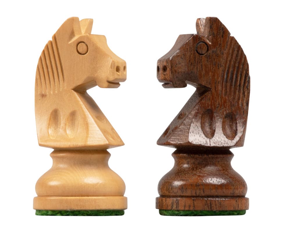 Acacia and light wood knight pieces from the Down Head Acacia Championship Chess Set