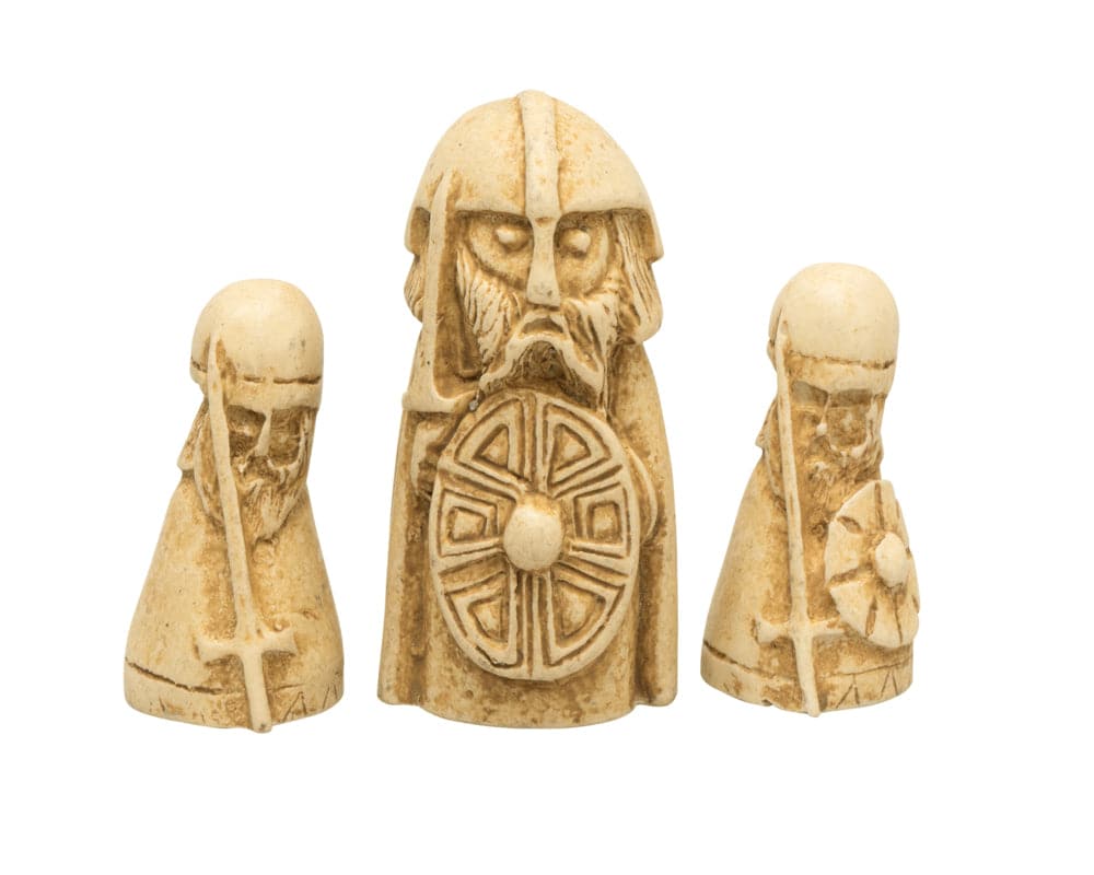 Hnefatafl Viking game pieces with intricate carvings and shields