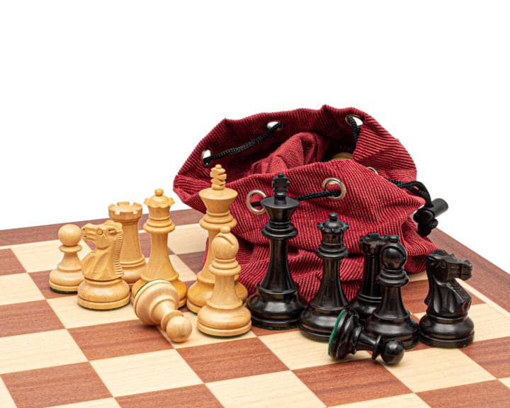 The British Staunton black and mahogany chess set with boxwood chessmen, storage bag, and beautifully crafted board.